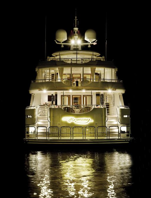 luxury yacht HARMONY lit up at night