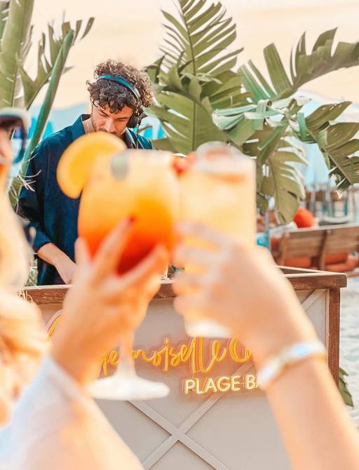 DJ in action at Plage Mademoiselle Gray