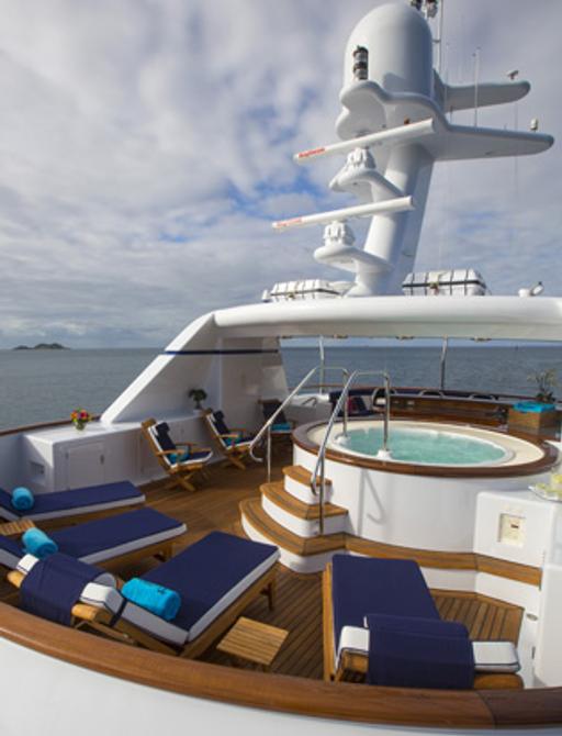 Jacuzzi and sun loungers on sundeck of superyacht TELEOST 