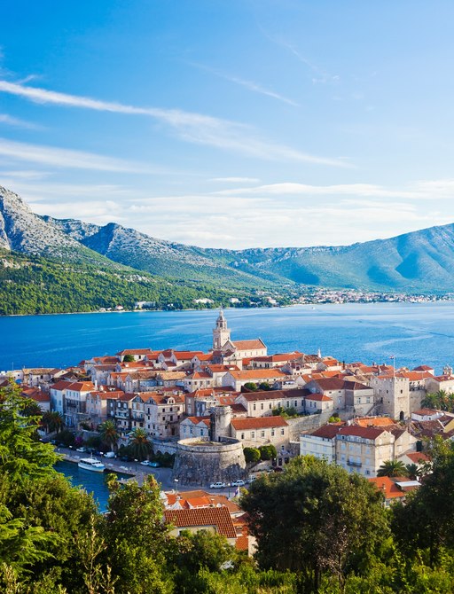 Korcula Island, Croatia, with beautiful mountain backdrop and village in foreground