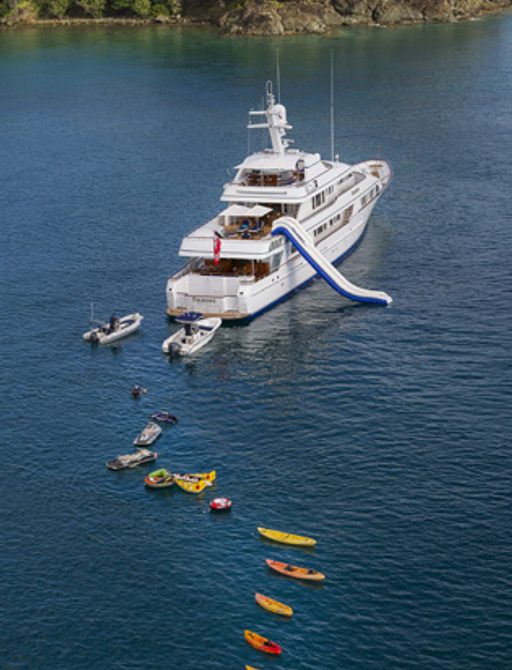 motor yacht TELEOST anchors on a luxury yacht charter alongside water toys