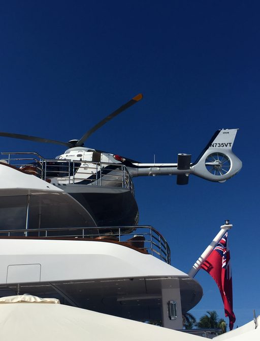 a helicopter on the sundeck of superyacht VANISH at FLIBS 2017