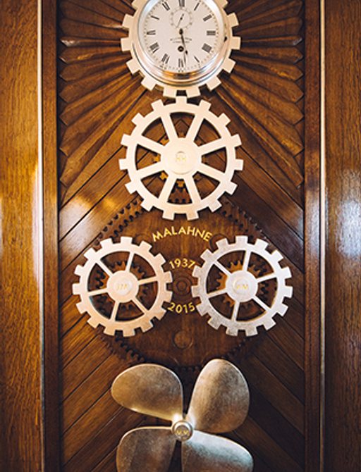Cogs and clock on board restored luxury yacht Malahne