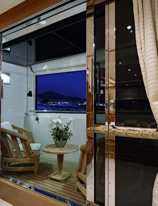private terrace with chairs and small table in master suite of luxury yacht EMOTION