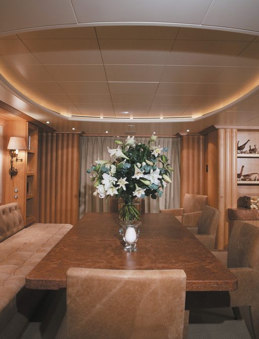 dining table in main salon of luxury yacht ALEXANDRA