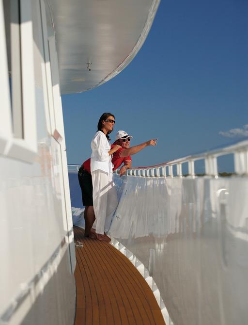 charter guests look across the water on board luxury yacht ‘Emerald Lady’