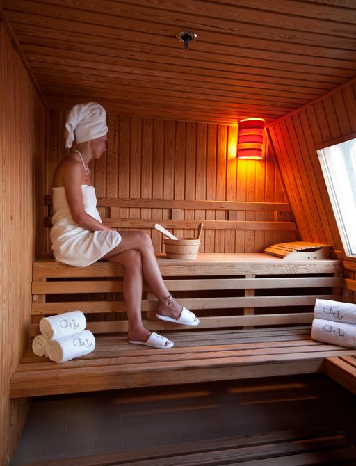 guest relaxes in the sauna on board motor yacht ‘Lauren L’ 