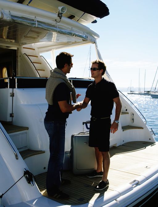 A superyacht deckhand greeting a guest