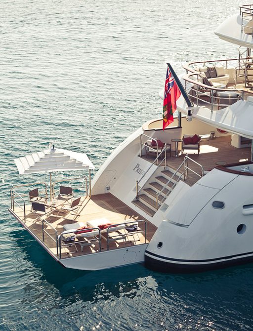 side view of the stern on motor yacht PRIDE with swim platform set up for relaxation