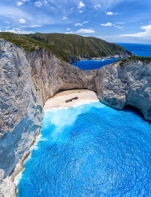 Aerial view of shipwreck cove in Greece, ideal destination for luxury yacht charters