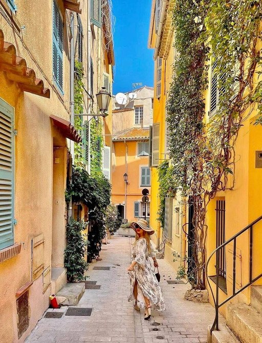 woman going down street in st tropez