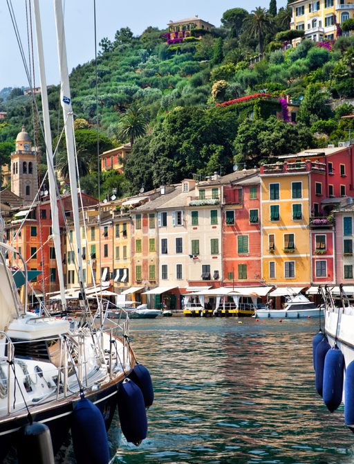 Portofino harbour lined with orange and yellow houses 