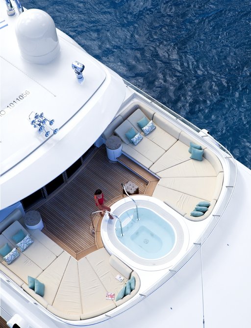aerial view of charter guest stepping into jacuzzi on board super yacht lady britt
