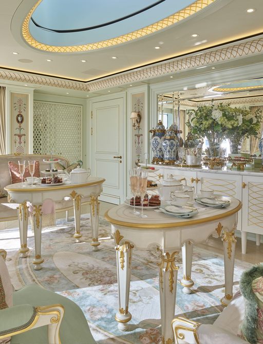 the elegant and classically styled interior of Feadship's TIS presenting a rococo decor palette of creams and pastels in the form of centre tables and chaise lounges