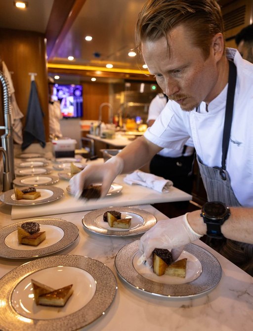 Superyacht chef plating food