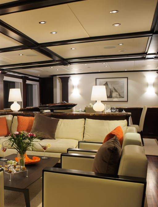 sociable lounge area in main salon of charter yacht L’Albatros