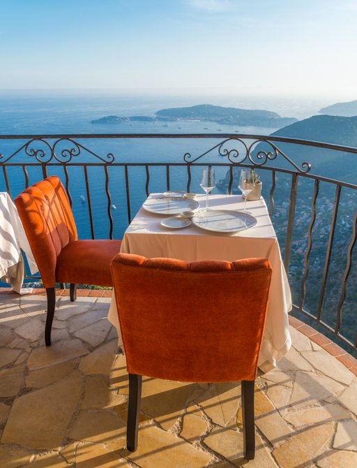 Restaurant table in Eze, France overlooking the Mediterranean