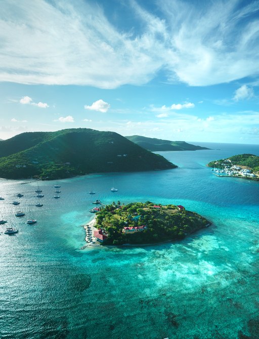 aerial shot of the virgin islands with turquoise water and coral reefs visible