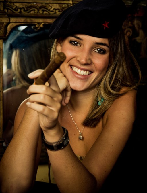 A girl smoking a Cuba cigar