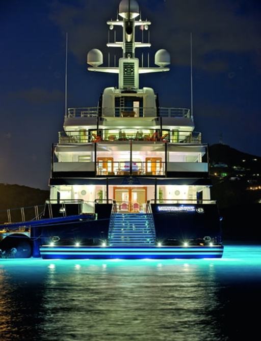 stern view of superyacht ‘Northern Star’  lit up at night