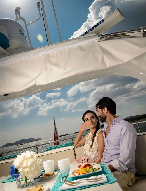 charter guests enjoy breakfast on the main deck aft of superyacht AMAYA 