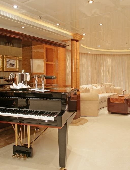 luxury motor yacht LADY LOLA main salon with sofa's and grand piano
