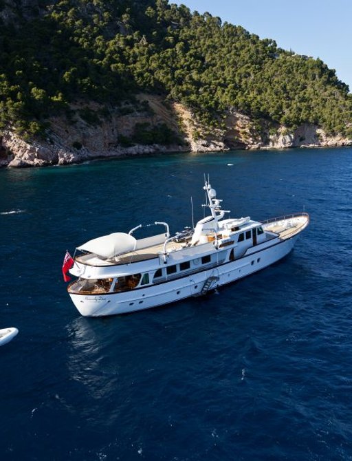 classic yacht ‘Heavenly Daze’ sails alongside her tender in the idyllic Mediterranean waters
