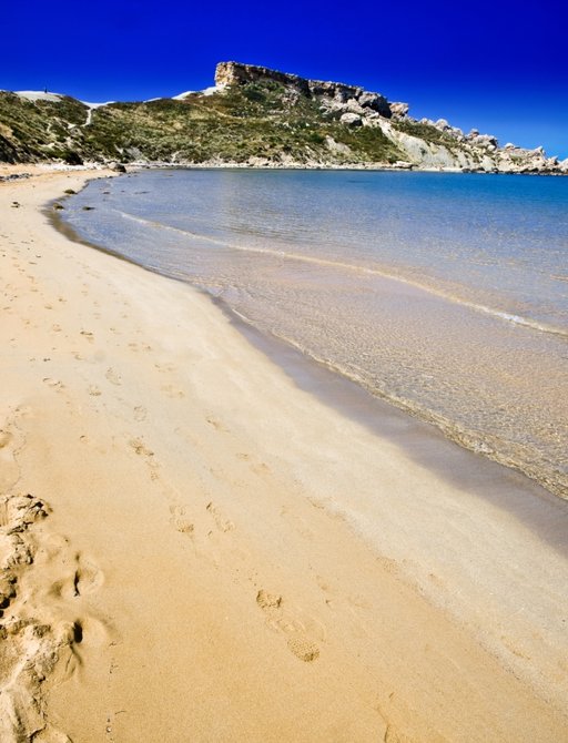 Beautiful stretch of golden sand along the coast of Malta