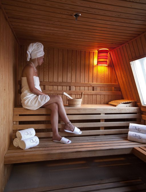 guest relaxes in the sauna on board motor yacht ‘Lauren L’ 
