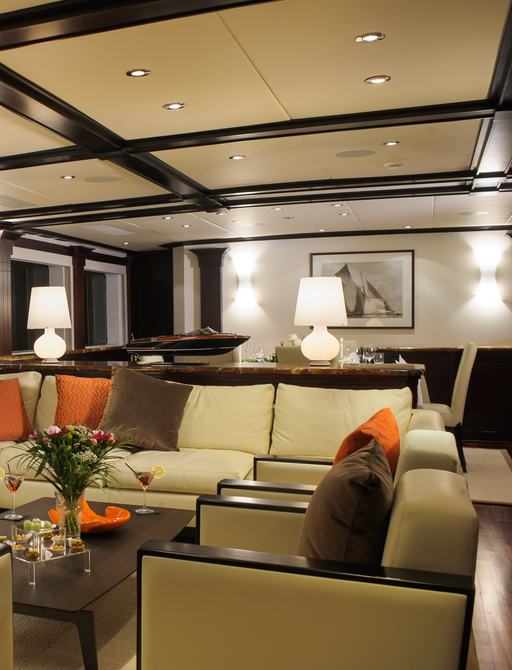 sociable lounge area in main salon of charter yacht L’Albatros