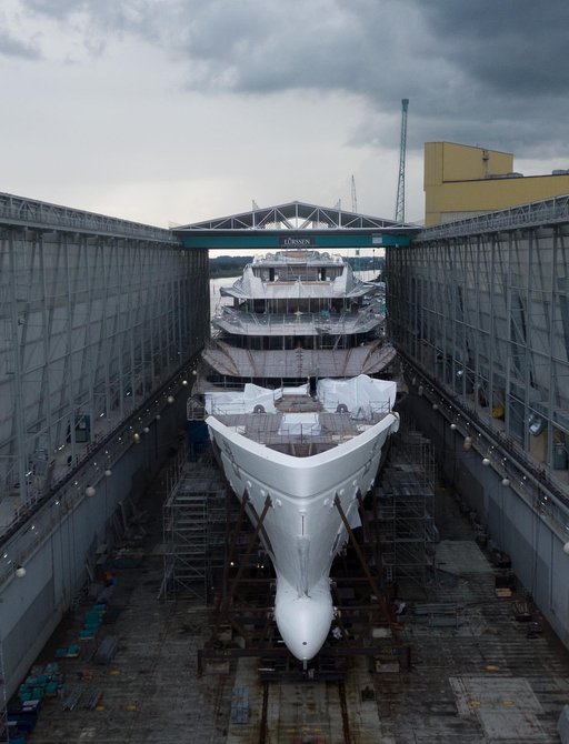 Forward facing view of Lurssen superyacht DEEP BLUE in a floating dock with bow attached.