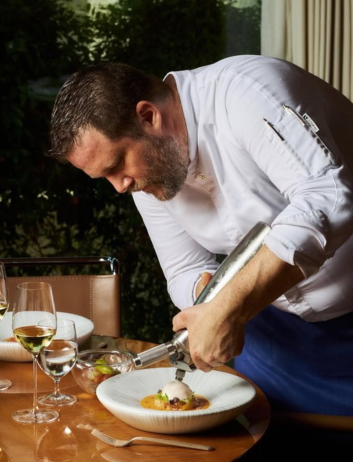 Chef Nicolas Rondelli finishing creating dish