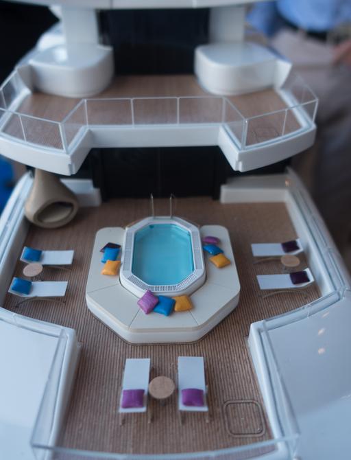 Model of aft deck pool and lounging area on superyacht ARTEFACT