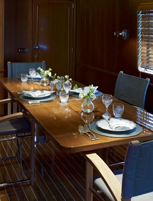 formal dining area in main salon of luxury yacht ‘Heavenly Daze’