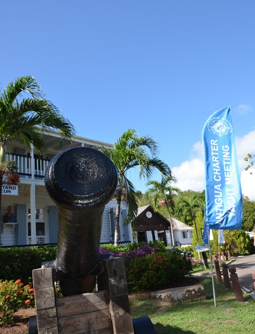 Canyon and Antigua Charter Yacht Show flag outside The Officers Quarters in Nelsons Dockyard, Antigua