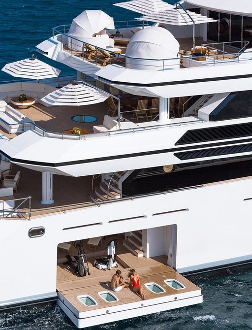 close up of starboard side of luxury yacht IRIMARI with drop down swim platform