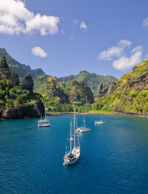 sailing yachts anchoring in the Bay of Vergins, Fatu Hiva Island, Marquess Islands, French Polynesia