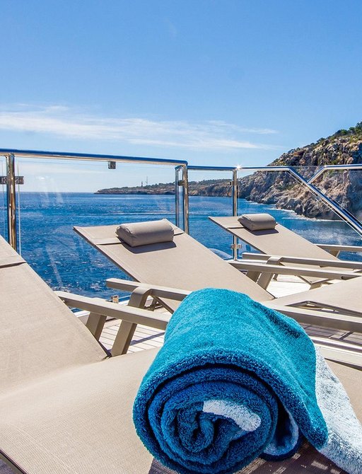 Row of sun loungers aboard luxury yacht LULU 