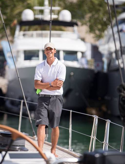 member of crew stands on deck at the Palma Superyacht Show 2018