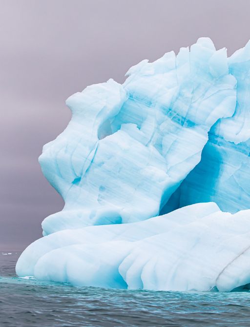 A blue-tinged iceberg in Svalbard, Arctic North
