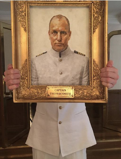 Actor Woody Harrelson holds up a self portrait during the fiiming of Cannes' Palme d'Or winner Triangle of Sadness