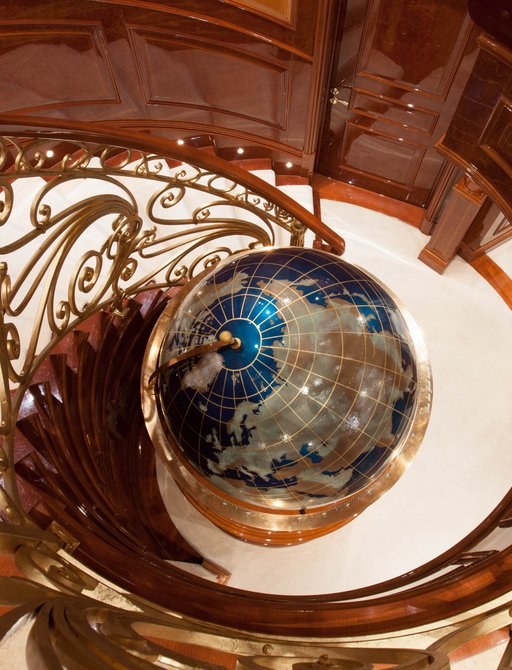 globe at base of staircase on luxury yacht st david