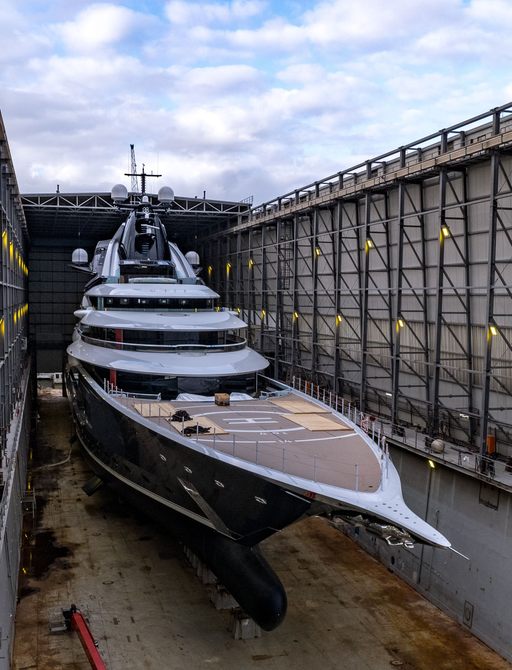 Frontal view of Lurssen Project Jag in a floating construction shed.
