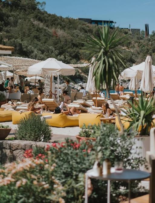 Parasols and yellow seating on Lucca Beach