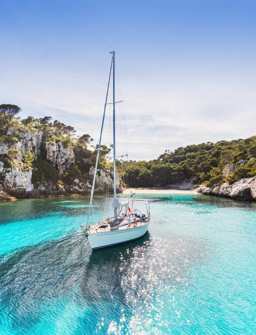 Sailing yacht anchored in the turquoise waters of the Balearic Islands
