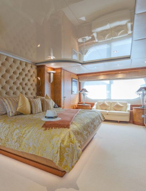 Charter yacht AZUL V master cabin with large windows and central berth