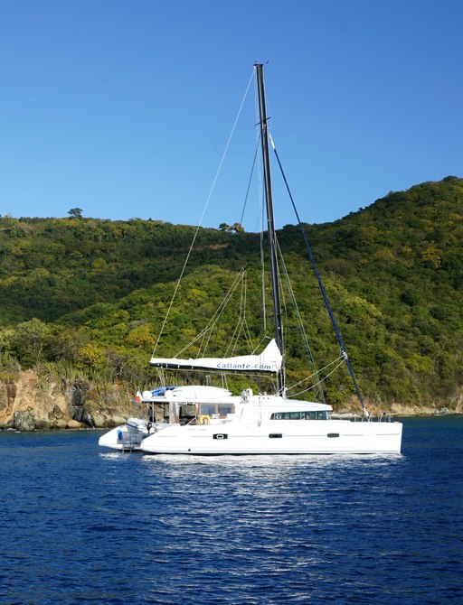 Canouan, St Vincent & Grenadines bay with catamaran charter yacht