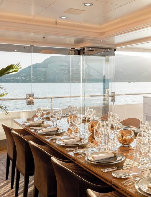 light hitting the dining table in the winter garden on board superyacht joy