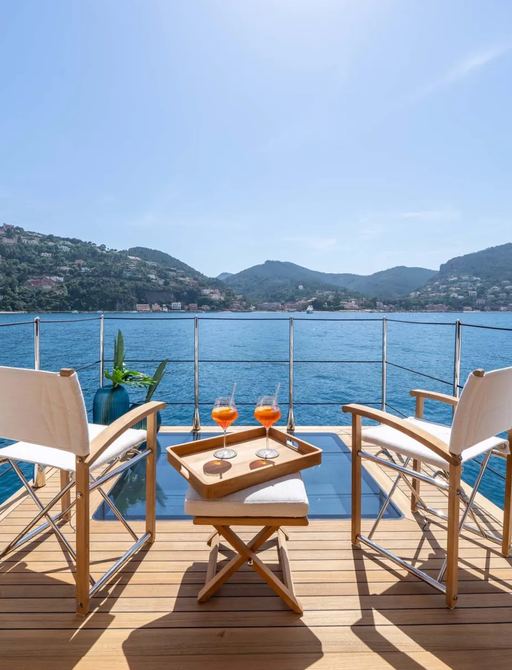 Superyacht charter QU2 fold-down balcony with seats