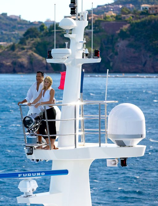 charter guests taking in the views of Papua New Guinea from the crow's nest aboard luxury yacht BELUGA